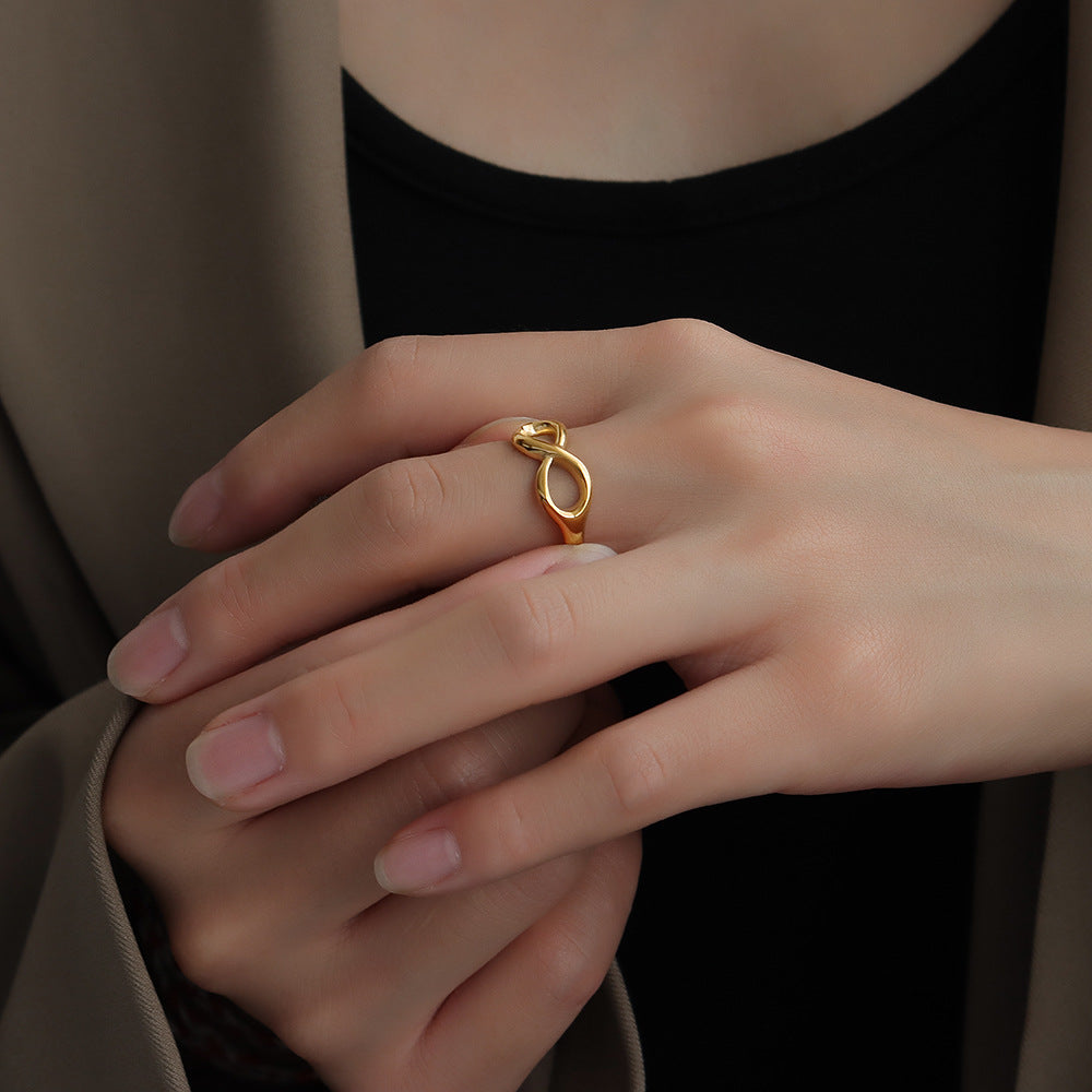 Titanium steel 18K gold plated geometric stripe ring on hand, Close-up of horizontal striped design on gold plated ring, Luxury gift box with 18K gold titanium steel jewelry, Water-resistant gold plated ring with recycled titanium steel,Two-year guarantee hypoallergenic gold tone ring
