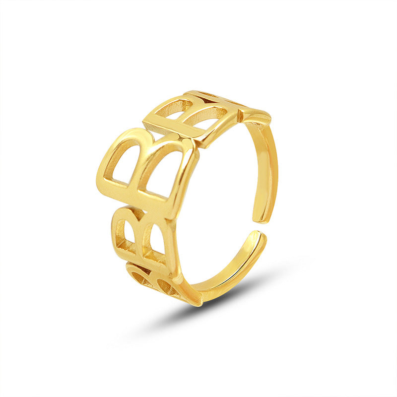 Titanium steel 18K gold plated geometric stripe ring on hand, Close-up of horizontal striped design on gold plated ring, Luxury gift box with 18K gold titanium steel jewelry, Water-resistant gold plated ring with recycled titanium steel,Two-year guarantee hypoallergenic gold tone ring