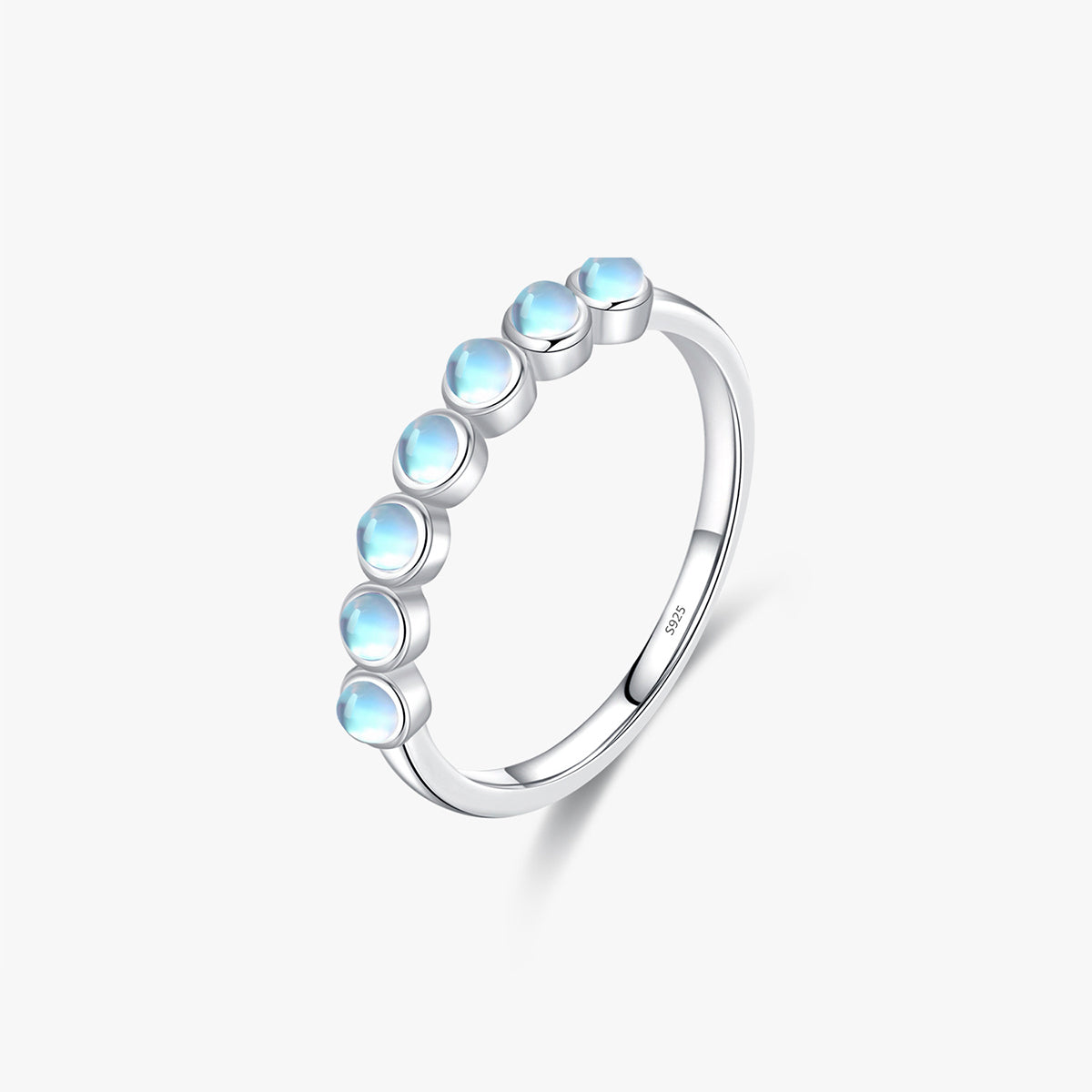 Stackable sterling silver moonstone ring on finger, Ins style moonstone ring with celestial glow, Recycled silver moonstone stacking band jewelry,Close-up of natural moonstone in silver ring setting, Minimalist moonstone ring for layered arm candy