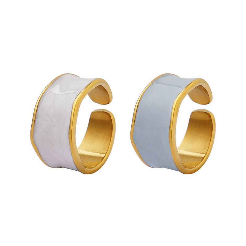 Titanium steel 18K gold plated geometric stripe ring on hand, Close-up of horizontal striped design on gold plated ring, Luxury gift box with 18K gold titanium steel jewelry, Water-resistant gold plated ring with recycled titanium steel,Two-year guarantee hypoallergenic gold tone ring