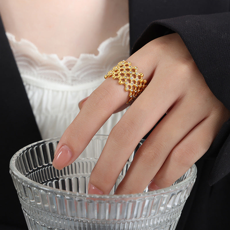 Titanium steel 18K gold plated geometric stripe ring on hand, Close-up of horizontal striped design on gold plated ring, Luxury gift box with 18K gold titanium steel jewelry, Water-resistant gold plated ring with recycled titanium steel,Two-year guarantee hypoallergenic gold tone ring