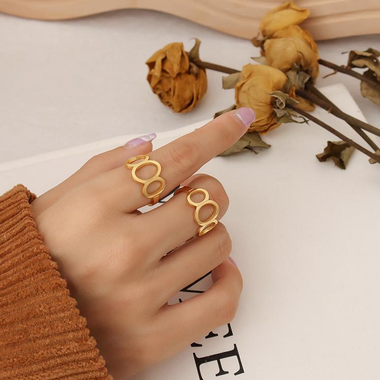 Titanium steel 18K gold plated geometric stripe ring on hand, Close-up of horizontal striped design on gold plated ring, Luxury gift box with 18K gold titanium steel jewelry, Water-resistant gold plated ring with recycled titanium steel,Two-year guarantee hypoallergenic gold tone ring
