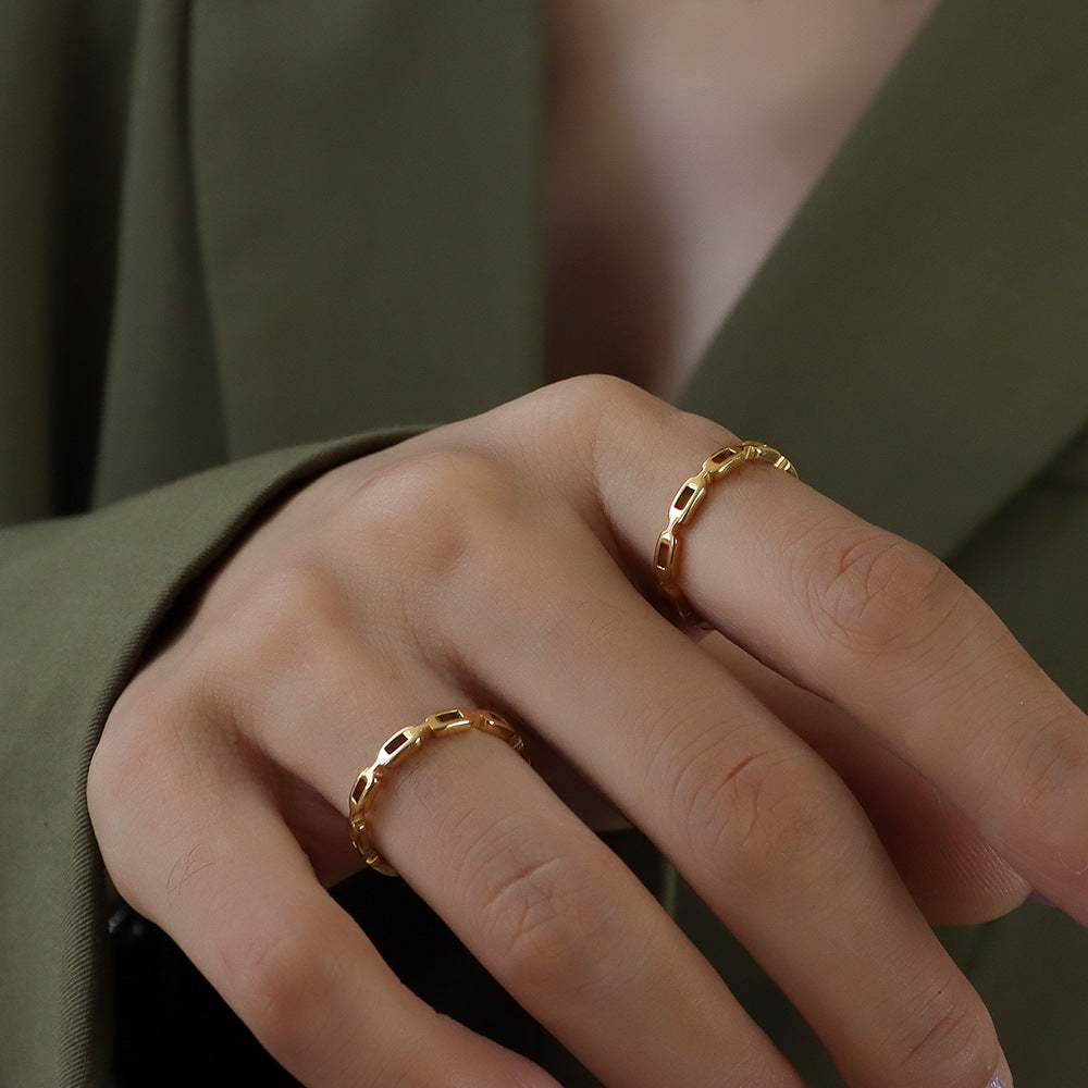 Titanium steel 18K gold plated geometric stripe ring on hand, Close-up of horizontal striped design on gold plated ring, Luxury gift box with 18K gold titanium steel jewelry, Water-resistant gold plated ring with recycled titanium steel,Two-year guarantee hypoallergenic gold tone ring