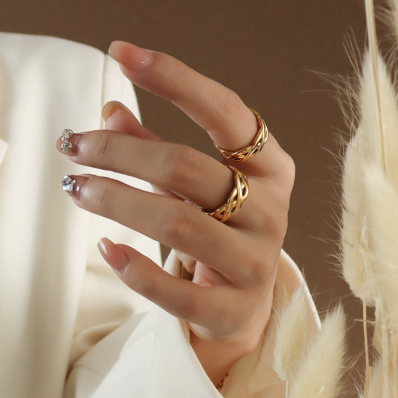 Titanium steel 18K gold plated geometric stripe ring on hand, Close-up of horizontal striped design on gold plated ring, Luxury gift box with 18K gold titanium steel jewelry, Water-resistant gold plated ring with recycled titanium steel,Two-year guarantee hypoallergenic gold tone ring