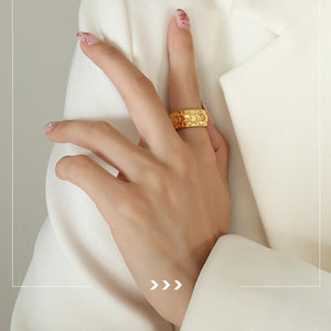 Titanium steel 18K gold plated geometric stripe ring on hand, Close-up of horizontal striped design on gold plated ring, Luxury gift box with 18K gold titanium steel jewelry, Water-resistant gold plated ring with recycled titanium steel,Two-year guarantee hypoallergenic gold tone ring