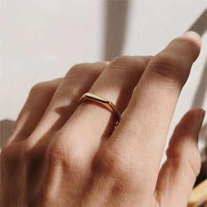 Titanium steel 18K gold plated geometric stripe ring on hand, Close-up of horizontal striped design on gold plated ring, Luxury gift box with 18K gold titanium steel jewelry, Water-resistant gold plated ring with recycled titanium steel,Two-year guarantee hypoallergenic gold tone ring
