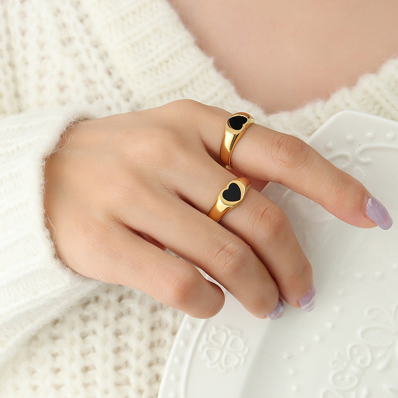 Titanium steel 18K gold plated geometric stripe ring on hand, Close-up of horizontal striped design on gold plated ring, Luxury gift box with 18K gold titanium steel jewelry, Water-resistant gold plated ring with recycled titanium steel,Two-year guarantee hypoallergenic gold tone ring