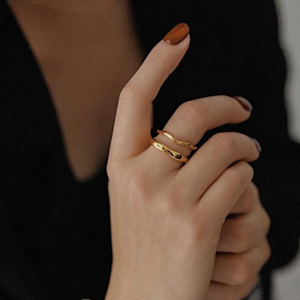 Titanium steel 18K gold plated geometric stripe ring on hand, Close-up of horizontal striped design on gold plated ring, Luxury gift box with 18K gold titanium steel jewelry, Water-resistant gold plated ring with recycled titanium steel,Two-year guarantee hypoallergenic gold tone ring