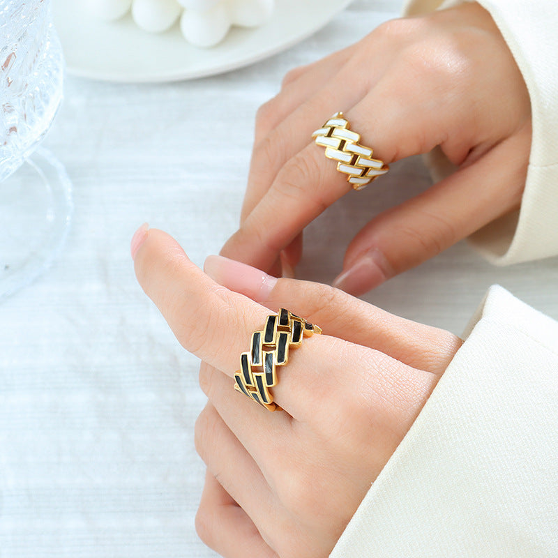 Titanium steel 18K gold plated geometric stripe ring on hand, Close-up of horizontal striped design on gold plated ring, Luxury gift box with 18K gold titanium steel jewelry, Water-resistant gold plated ring with recycled titanium steel,Two-year guarantee hypoallergenic gold tone ring