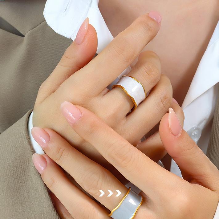 Titanium steel 18K gold plated geometric stripe ring on hand, Close-up of horizontal striped design on gold plated ring, Luxury gift box with 18K gold titanium steel jewelry, Water-resistant gold plated ring with recycled titanium steel,Two-year guarantee hypoallergenic gold tone ring