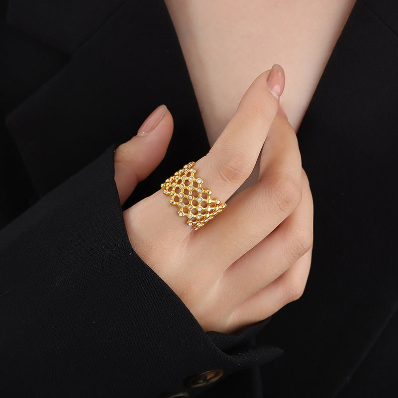 Titanium steel 18K gold plated geometric stripe ring on hand, Close-up of horizontal striped design on gold plated ring, Luxury gift box with 18K gold titanium steel jewelry, Water-resistant gold plated ring with recycled titanium steel,Two-year guarantee hypoallergenic gold tone ring