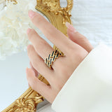 Titanium steel 18K gold plated geometric stripe ring on hand, Close-up of horizontal striped design on gold plated ring, Luxury gift box with 18K gold titanium steel jewelry, Water-resistant gold plated ring with recycled titanium steel,Two-year guarantee hypoallergenic gold tone ring