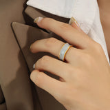 Titanium steel 18K gold plated geometric stripe ring on hand, Close-up of horizontal striped design on gold plated ring, Luxury gift box with 18K gold titanium steel jewelry, Water-resistant gold plated ring with recycled titanium steel,Two-year guarantee hypoallergenic gold tone ring