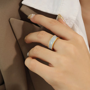 Titanium steel 18K gold plated geometric stripe ring on hand, Close-up of horizontal striped design on gold plated ring, Luxury gift box with 18K gold titanium steel jewelry, Water-resistant gold plated ring with recycled titanium steel,Two-year guarantee hypoallergenic gold tone ring