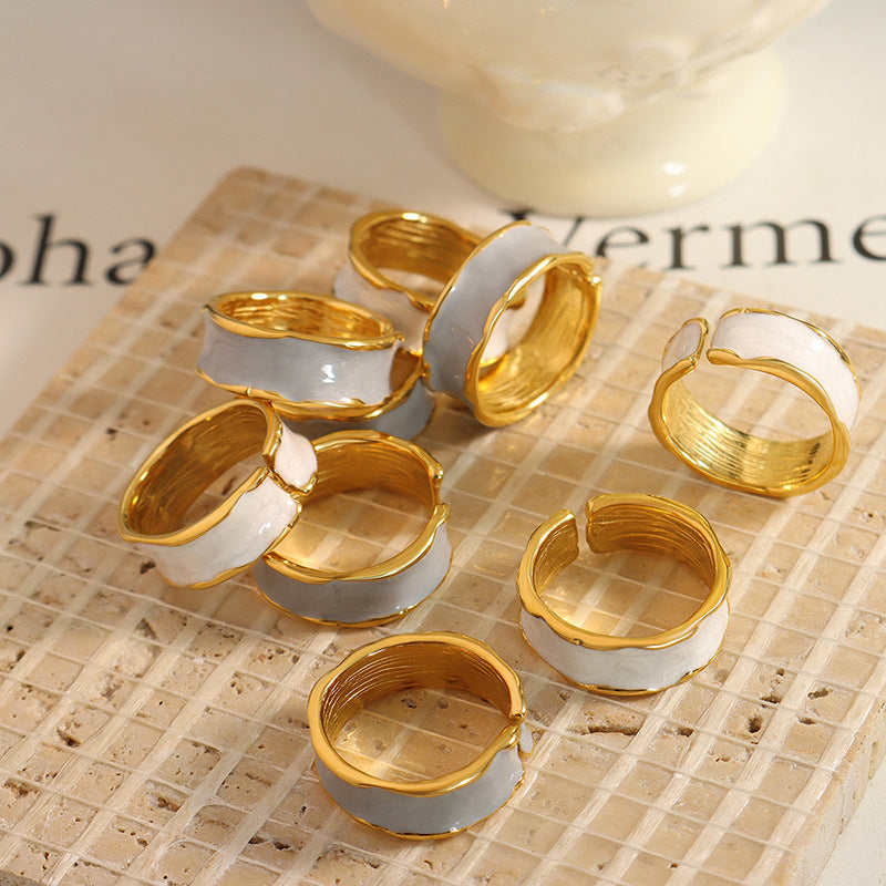 Titanium steel 18K gold plated geometric stripe ring on hand, Close-up of horizontal striped design on gold plated ring, Luxury gift box with 18K gold titanium steel jewelry, Water-resistant gold plated ring with recycled titanium steel,Two-year guarantee hypoallergenic gold tone ring