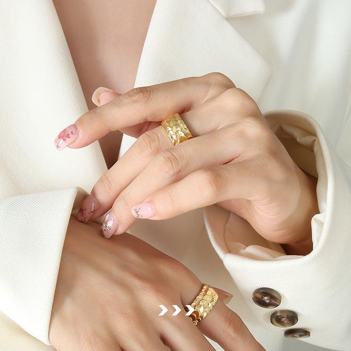Titanium steel 18K gold plated geometric stripe ring on hand, Close-up of horizontal striped design on gold plated ring, Luxury gift box with 18K gold titanium steel jewelry, Water-resistant gold plated ring with recycled titanium steel,Two-year guarantee hypoallergenic gold tone ring