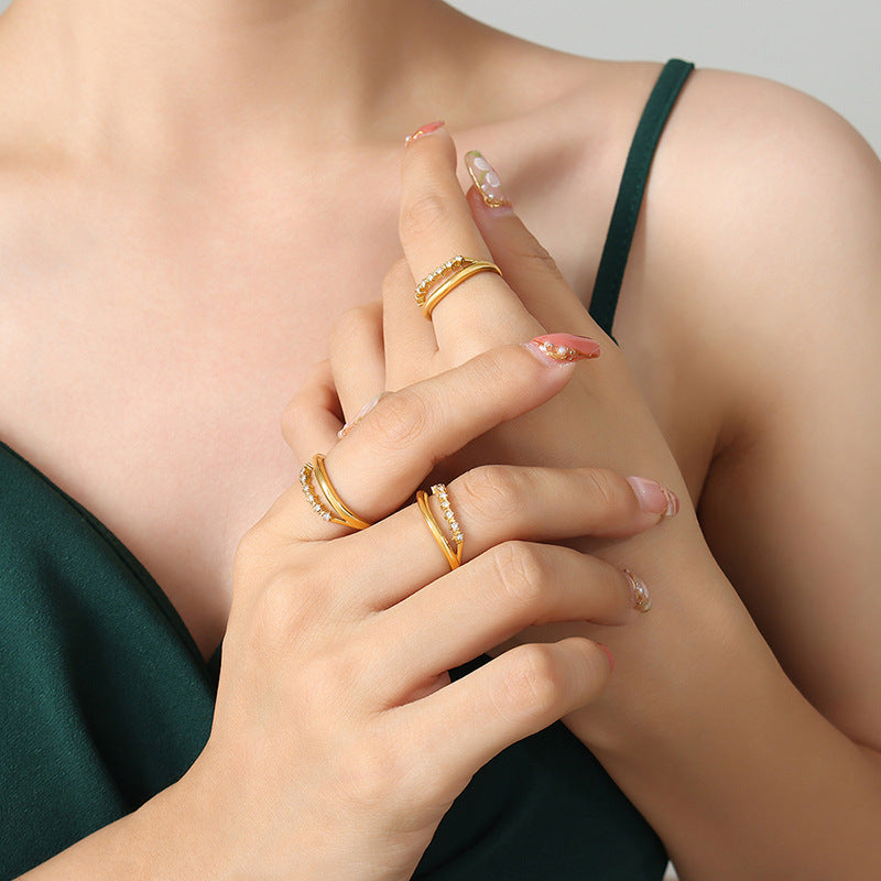 Titanium steel 18K gold plated geometric stripe ring on hand, Close-up of horizontal striped design on gold plated ring, Luxury gift box with 18K gold titanium steel jewelry, Water-resistant gold plated ring with recycled titanium steel,Two-year guarantee hypoallergenic gold tone ring