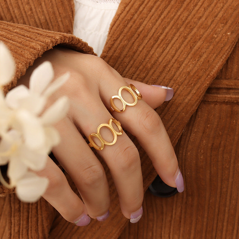 Titanium steel 18K gold plated geometric stripe ring on hand, Close-up of horizontal striped design on gold plated ring, Luxury gift box with 18K gold titanium steel jewelry, Water-resistant gold plated ring with recycled titanium steel,Two-year guarantee hypoallergenic gold tone ring