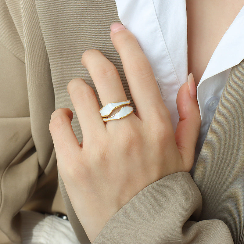Titanium steel 18K gold plated geometric stripe ring on hand, Close-up of horizontal striped design on gold plated ring, Luxury gift box with 18K gold titanium steel jewelry, Water-resistant gold plated ring with recycled titanium steel,Two-year guarantee hypoallergenic gold tone ring