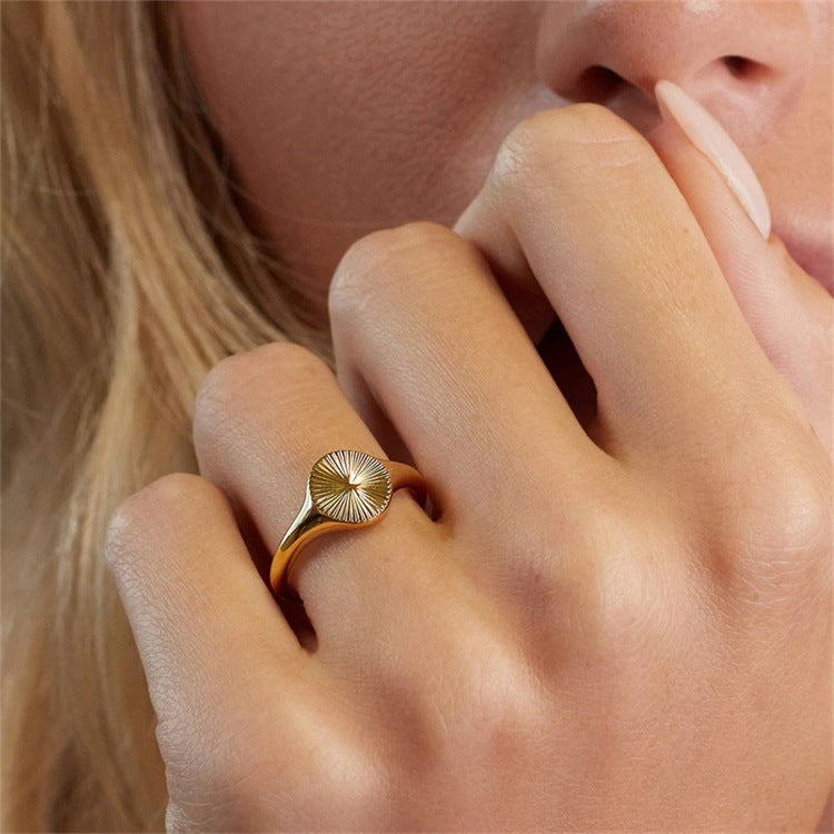 Titanium steel 18K gold plated geometric stripe ring on hand, Close-up of horizontal striped design on gold plated ring, Luxury gift box with 18K gold titanium steel jewelry, Water-resistant gold plated ring with recycled titanium steel,Two-year guarantee hypoallergenic gold tone ring