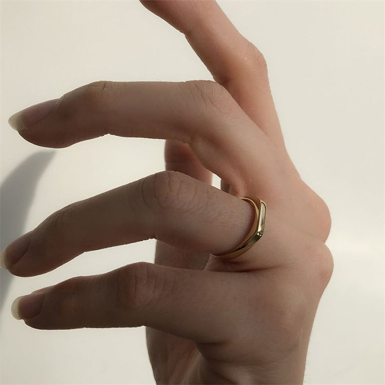 Titanium steel 18K gold plated geometric stripe ring on hand, Close-up of horizontal striped design on gold plated ring, Luxury gift box with 18K gold titanium steel jewelry, Water-resistant gold plated ring with recycled titanium steel,Two-year guarantee hypoallergenic gold tone ring