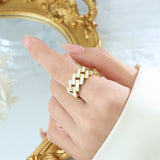 Titanium steel 18K gold plated geometric stripe ring on hand, Close-up of horizontal striped design on gold plated ring, Luxury gift box with 18K gold titanium steel jewelry, Water-resistant gold plated ring with recycled titanium steel,Two-year guarantee hypoallergenic gold tone ring