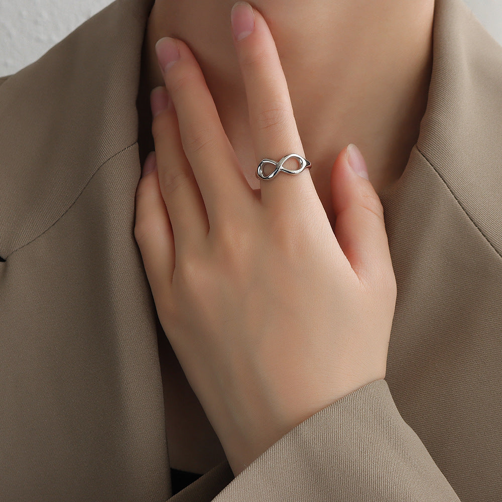 Titanium steel 18K gold plated geometric stripe ring on hand, Close-up of horizontal striped design on gold plated ring, Luxury gift box with 18K gold titanium steel jewelry, Water-resistant gold plated ring with recycled titanium steel,Two-year guarantee hypoallergenic gold tone ring