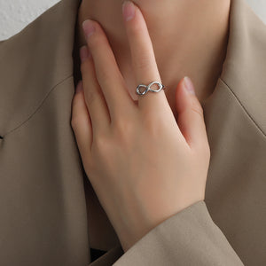Titanium steel 18K gold plated geometric stripe ring on hand, Close-up of horizontal striped design on gold plated ring, Luxury gift box with 18K gold titanium steel jewelry, Water-resistant gold plated ring with recycled titanium steel,Two-year guarantee hypoallergenic gold tone ring