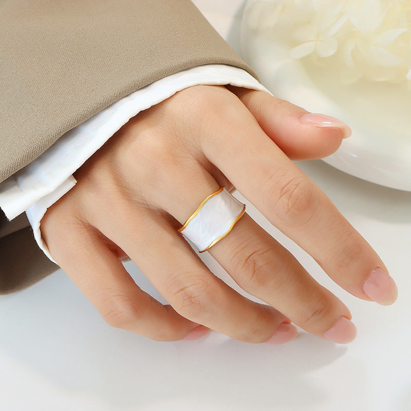 Titanium steel 18K gold plated geometric stripe ring on hand, Close-up of horizontal striped design on gold plated ring, Luxury gift box with 18K gold titanium steel jewelry, Water-resistant gold plated ring with recycled titanium steel,Two-year guarantee hypoallergenic gold tone ring