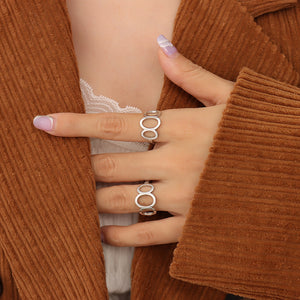 Titanium steel 18K gold plated geometric stripe ring on hand, Close-up of horizontal striped design on gold plated ring, Luxury gift box with 18K gold titanium steel jewelry, Water-resistant gold plated ring with recycled titanium steel,Two-year guarantee hypoallergenic gold tone ring