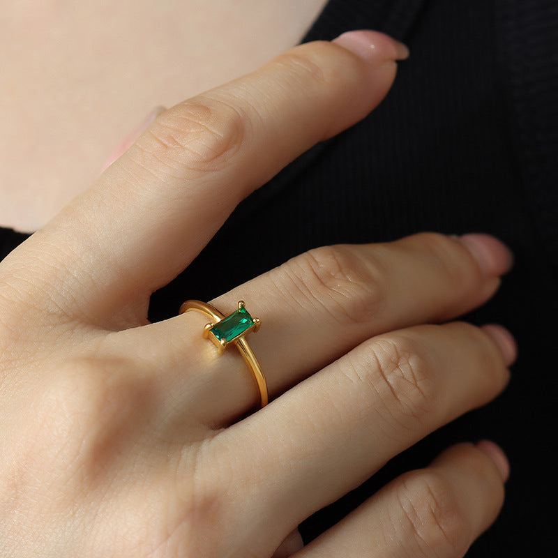 Titanium steel 18K gold plated geometric stripe ring on hand, Close-up of horizontal striped design on gold plated ring, Luxury gift box with 18K gold titanium steel jewelry, Water-resistant gold plated ring with recycled titanium steel,Two-year guarantee hypoallergenic gold tone ring