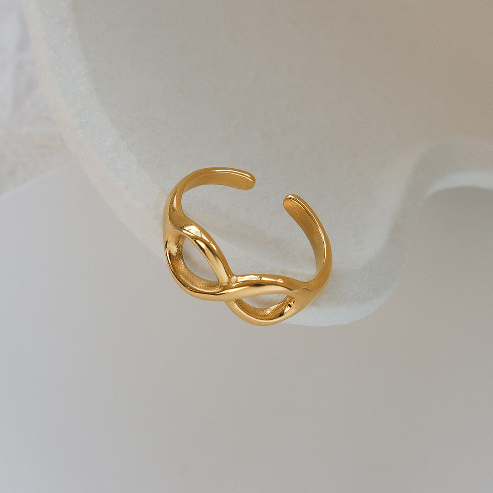 Titanium steel 18K gold plated geometric stripe ring on hand, Close-up of horizontal striped design on gold plated ring, Luxury gift box with 18K gold titanium steel jewelry, Water-resistant gold plated ring with recycled titanium steel,Two-year guarantee hypoallergenic gold tone ring