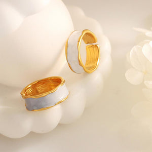 Titanium steel 18K gold plated geometric stripe ring on hand, Close-up of horizontal striped design on gold plated ring, Luxury gift box with 18K gold titanium steel jewelry, Water-resistant gold plated ring with recycled titanium steel,Two-year guarantee hypoallergenic gold tone ring