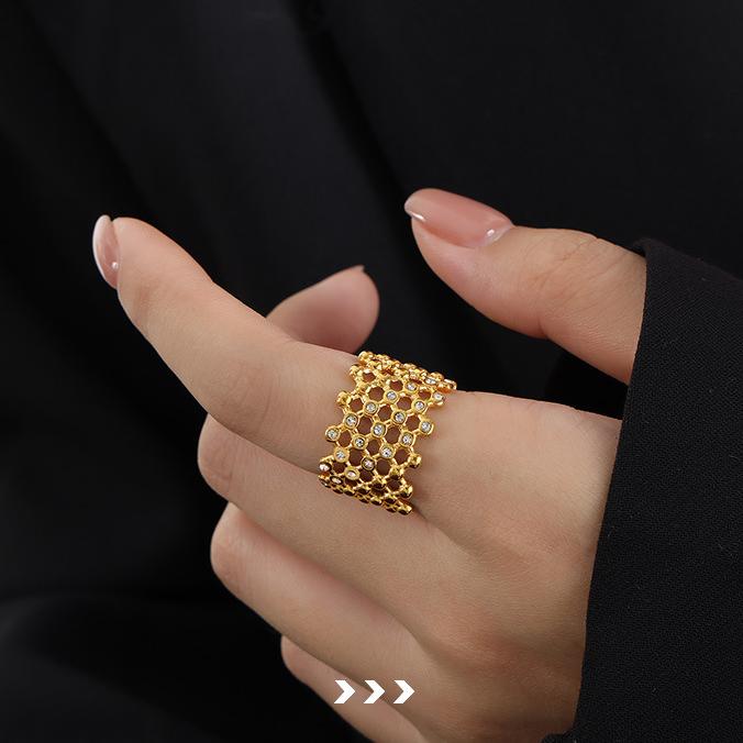 Titanium steel 18K gold plated geometric stripe ring on hand, Close-up of horizontal striped design on gold plated ring, Luxury gift box with 18K gold titanium steel jewelry, Water-resistant gold plated ring with recycled titanium steel,Two-year guarantee hypoallergenic gold tone ring