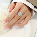 Titanium steel 18K gold plated geometric stripe ring on hand, Close-up of horizontal striped design on gold plated ring, Luxury gift box with 18K gold titanium steel jewelry, Water-resistant gold plated ring with recycled titanium steel,Two-year guarantee hypoallergenic gold tone ring