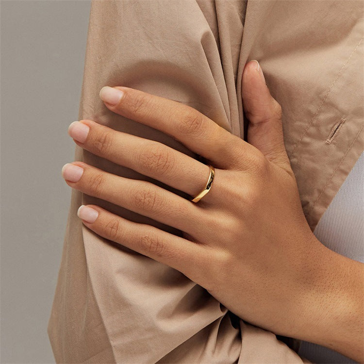 Titanium steel 18K gold plated geometric stripe ring on hand, Close-up of horizontal striped design on gold plated ring, Luxury gift box with 18K gold titanium steel jewelry, Water-resistant gold plated ring with recycled titanium steel,Two-year guarantee hypoallergenic gold tone ring
