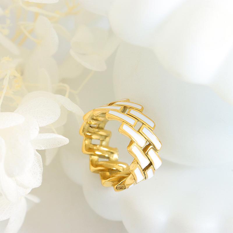 Titanium steel 18K gold plated geometric stripe ring on hand, Close-up of horizontal striped design on gold plated ring, Luxury gift box with 18K gold titanium steel jewelry, Water-resistant gold plated ring with recycled titanium steel,Two-year guarantee hypoallergenic gold tone ring