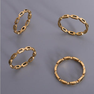 Titanium steel 18K gold plated geometric stripe ring on hand, Close-up of horizontal striped design on gold plated ring, Luxury gift box with 18K gold titanium steel jewelry, Water-resistant gold plated ring with recycled titanium steel,Two-year guarantee hypoallergenic gold tone ring