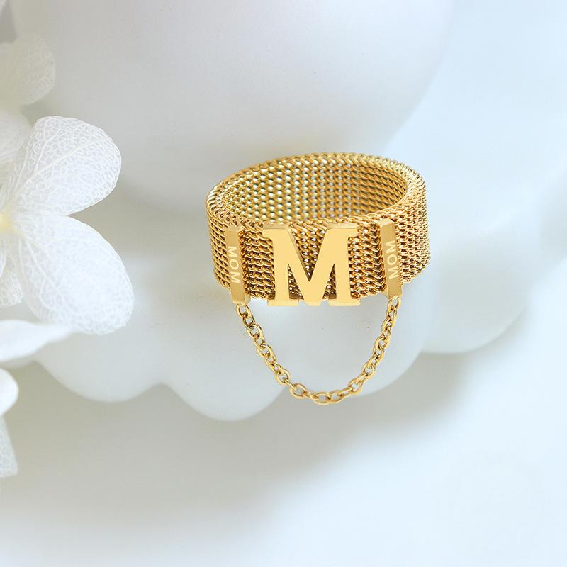 Titanium steel 18K gold plated geometric stripe ring on hand, Close-up of horizontal striped design on gold plated ring, Luxury gift box with 18K gold titanium steel jewelry, Water-resistant gold plated ring with recycled titanium steel,Two-year guarantee hypoallergenic gold tone ring