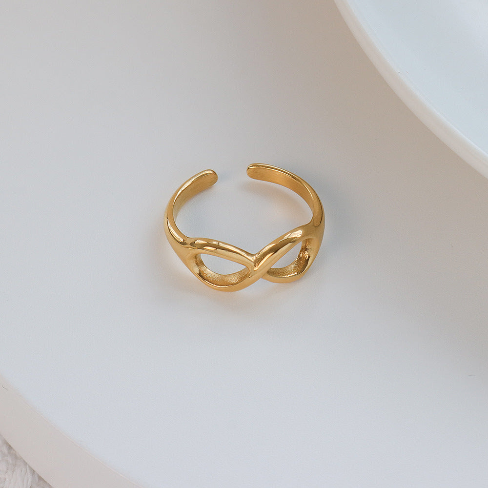 Titanium steel 18K gold plated geometric stripe ring on hand, Close-up of horizontal striped design on gold plated ring, Luxury gift box with 18K gold titanium steel jewelry, Water-resistant gold plated ring with recycled titanium steel,Two-year guarantee hypoallergenic gold tone ring