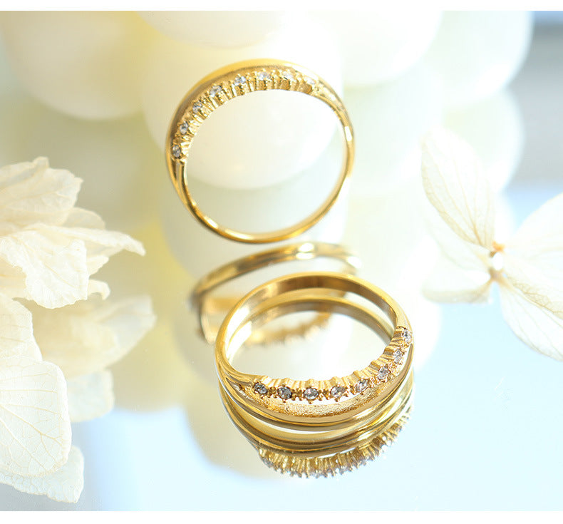 Titanium steel 18K gold plated geometric stripe ring on hand, Close-up of horizontal striped design on gold plated ring, Luxury gift box with 18K gold titanium steel jewelry, Water-resistant gold plated ring with recycled titanium steel,Two-year guarantee hypoallergenic gold tone ring