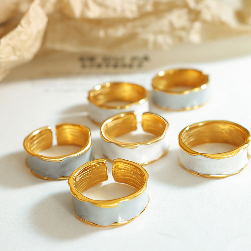 Titanium steel 18K gold plated geometric stripe ring on hand, Close-up of horizontal striped design on gold plated ring, Luxury gift box with 18K gold titanium steel jewelry, Water-resistant gold plated ring with recycled titanium steel,Two-year guarantee hypoallergenic gold tone ring