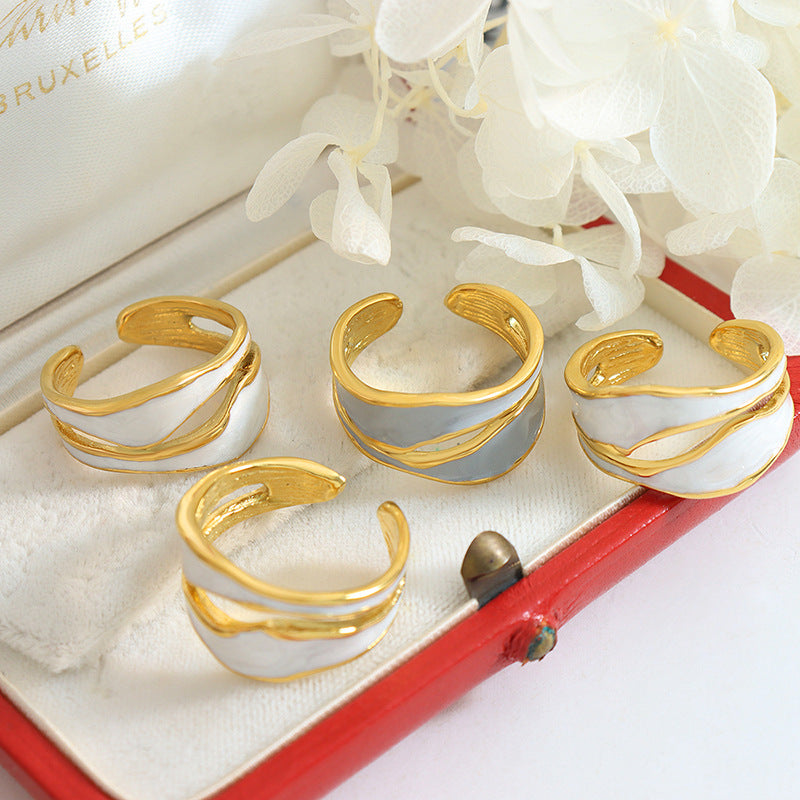Titanium steel 18K gold plated geometric stripe ring on hand, Close-up of horizontal striped design on gold plated ring, Luxury gift box with 18K gold titanium steel jewelry, Water-resistant gold plated ring with recycled titanium steel,Two-year guarantee hypoallergenic gold tone ring
