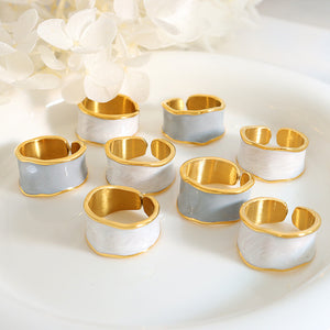 Titanium steel 18K gold plated geometric stripe ring on hand, Close-up of horizontal striped design on gold plated ring, Luxury gift box with 18K gold titanium steel jewelry, Water-resistant gold plated ring with recycled titanium steel,Two-year guarantee hypoallergenic gold tone ring