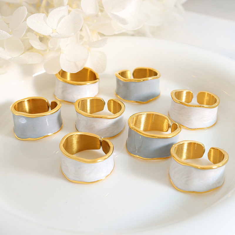 Titanium steel 18K gold plated geometric stripe ring on hand, Close-up of horizontal striped design on gold plated ring, Luxury gift box with 18K gold titanium steel jewelry, Water-resistant gold plated ring with recycled titanium steel,Two-year guarantee hypoallergenic gold tone ring