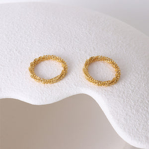 Titanium steel 18K gold plated geometric stripe ring on hand, Close-up of horizontal striped design on gold plated ring, Luxury gift box with 18K gold titanium steel jewelry, Water-resistant gold plated ring with recycled titanium steel,Two-year guarantee hypoallergenic gold tone ring