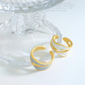 Titanium steel 18K gold plated geometric stripe ring on hand, Close-up of horizontal striped design on gold plated ring, Luxury gift box with 18K gold titanium steel jewelry, Water-resistant gold plated ring with recycled titanium steel,Two-year guarantee hypoallergenic gold tone ring