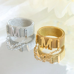 Titanium steel 18K gold plated geometric stripe ring on hand, Close-up of horizontal striped design on gold plated ring, Luxury gift box with 18K gold titanium steel jewelry, Water-resistant gold plated ring with recycled titanium steel,Two-year guarantee hypoallergenic gold tone ring