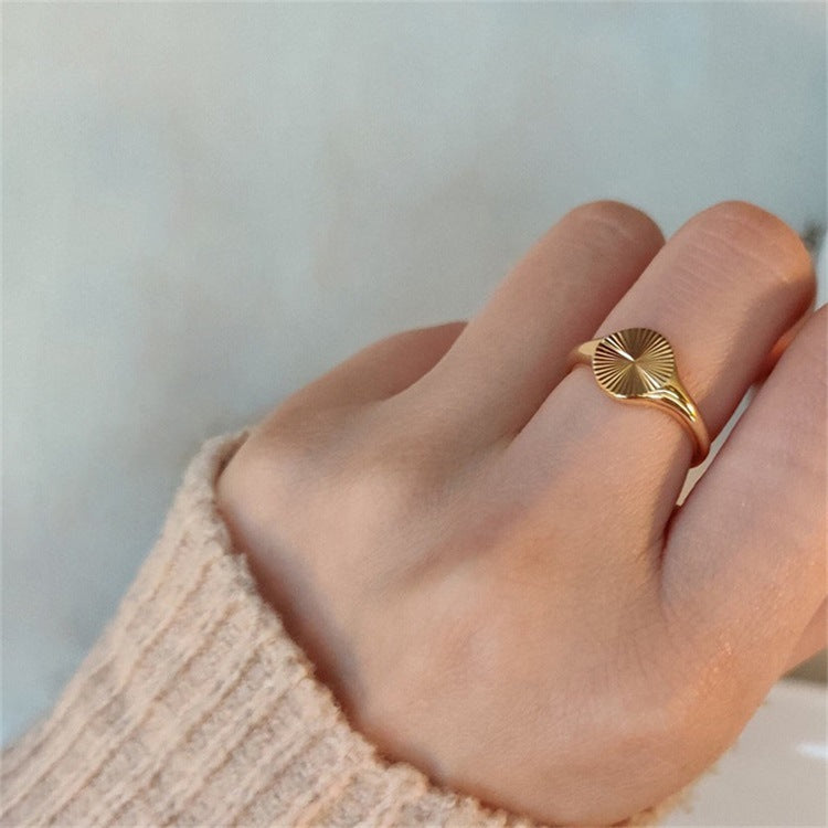 Titanium steel 18K gold plated geometric stripe ring on hand, Close-up of horizontal striped design on gold plated ring, Luxury gift box with 18K gold titanium steel jewelry, Water-resistant gold plated ring with recycled titanium steel,Two-year guarantee hypoallergenic gold tone ring