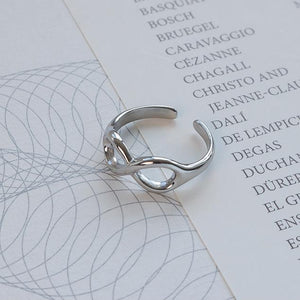 Titanium steel 18K gold plated geometric stripe ring on hand, Close-up of horizontal striped design on gold plated ring, Luxury gift box with 18K gold titanium steel jewelry, Water-resistant gold plated ring with recycled titanium steel,Two-year guarantee hypoallergenic gold tone ring